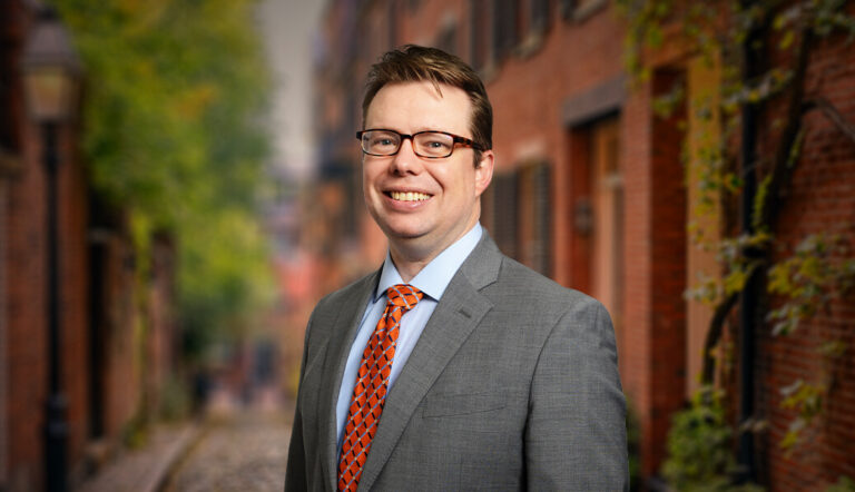 Charles H. Rieck IV standing outside